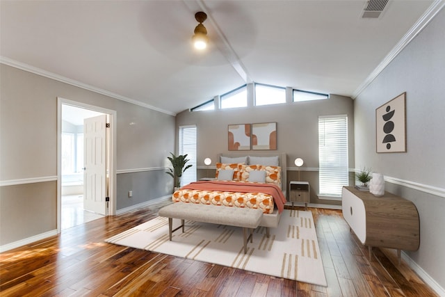 bedroom featuring lofted ceiling, wood-type flooring, visible vents, and crown molding