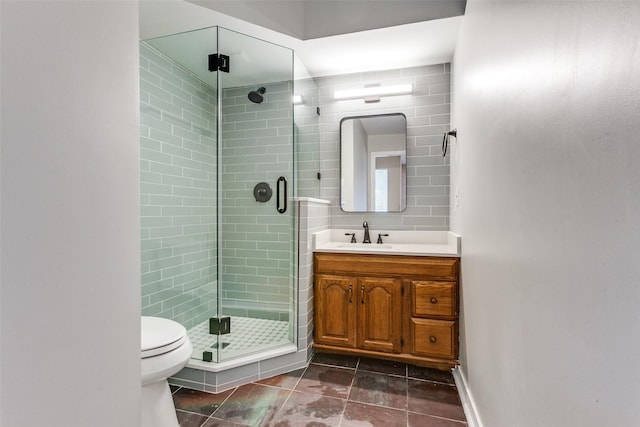 full bath featuring decorative backsplash, a stall shower, vanity, and toilet