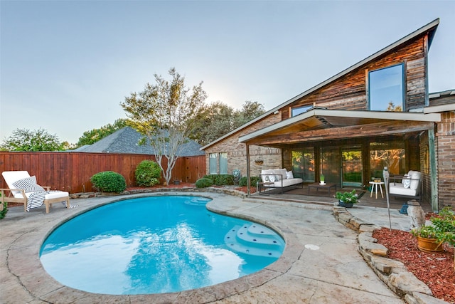 view of pool featuring a fenced in pool, a patio area, and a fenced backyard