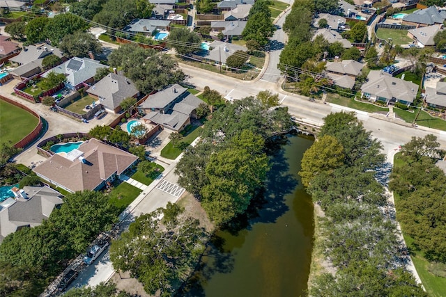 birds eye view of property featuring a residential view and a water view