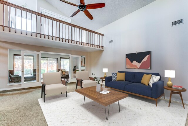 living area with carpet floors, a fireplace, a ceiling fan, high vaulted ceiling, and baseboards