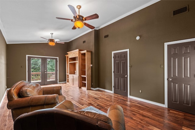 living room with visible vents, ornamental molding, and french doors