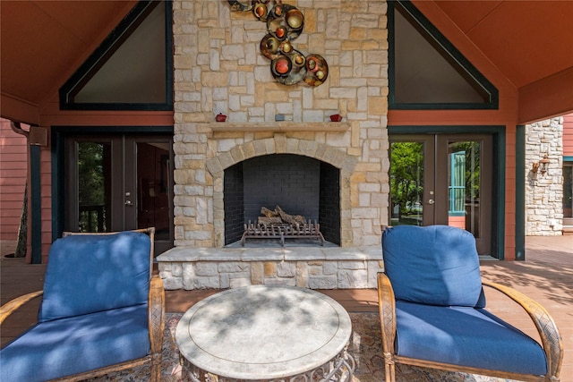 view of patio / terrace with an outdoor stone fireplace and french doors