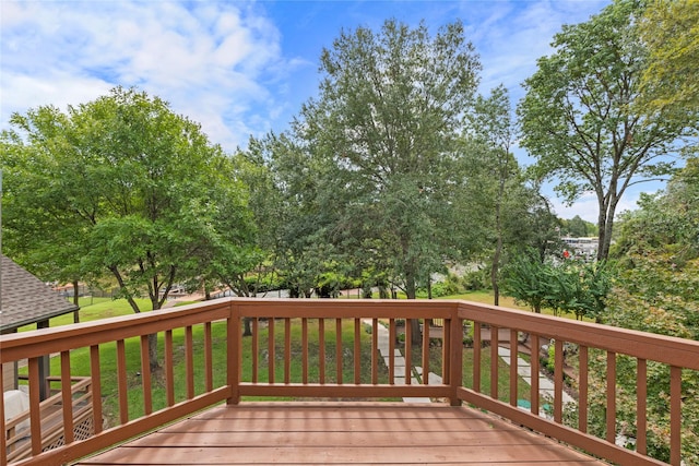 wooden terrace with a yard