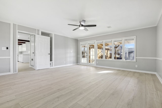 unfurnished living room featuring baseboards, light wood-type flooring, visible vents, and a ceiling fan