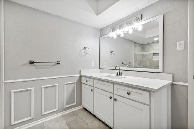 full bath featuring tile patterned floors and vanity