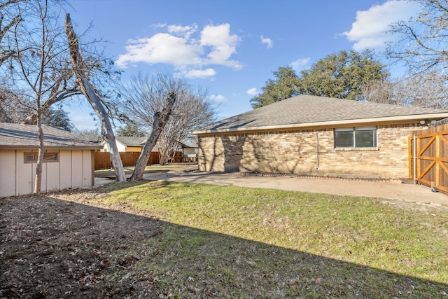 view of yard with fence and a patio