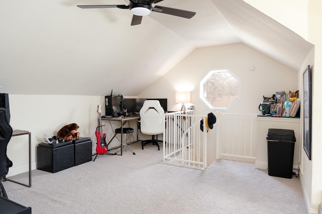 office with carpet floors and vaulted ceiling