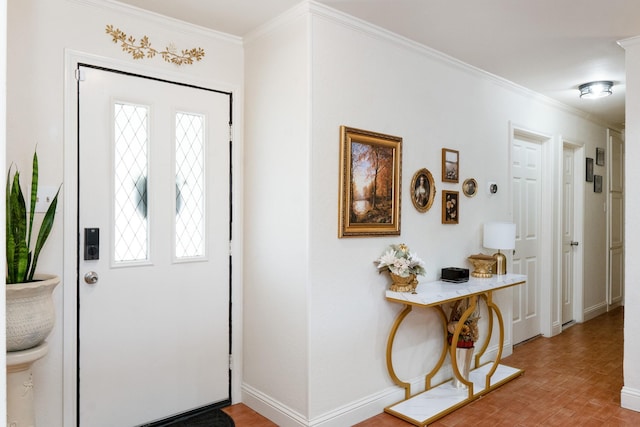 entrance foyer with a wealth of natural light, baseboards, brick floor, and crown molding