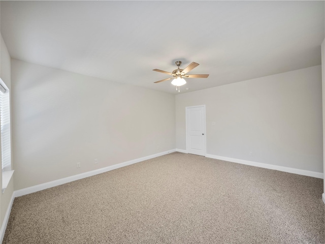 unfurnished room with baseboards, a ceiling fan, and light colored carpet