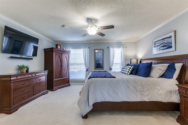 bedroom featuring light carpet, ornamental molding, ceiling fan, and a textured ceiling