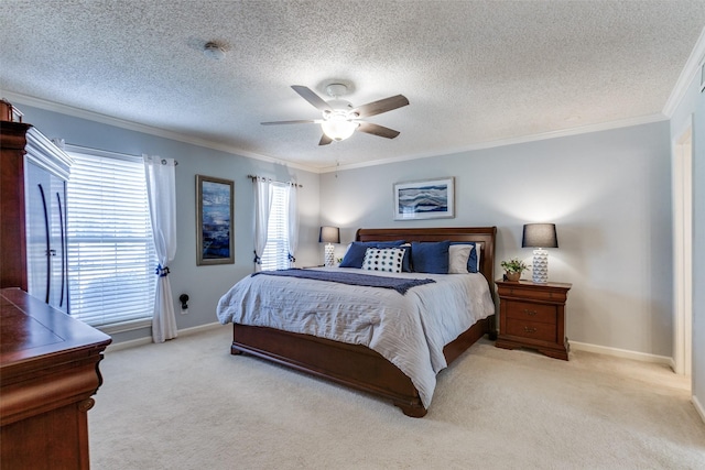 carpeted bedroom featuring baseboards, crown molding, ceiling fan, and a textured ceiling