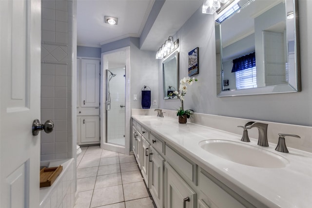 bathroom featuring ornamental molding, a stall shower, tile patterned flooring, and double vanity
