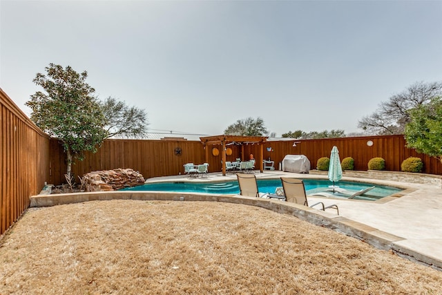 view of swimming pool with a hot tub, a fenced backyard, grilling area, and a patio