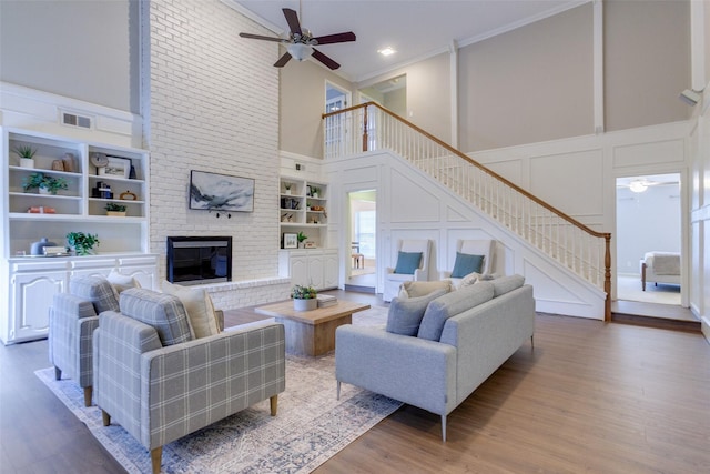 13 Gettysburg Ln, Richardson, TX 75080 - living room with ceiling fan, a decorative wall, stairs, built in features, and a high ceiling