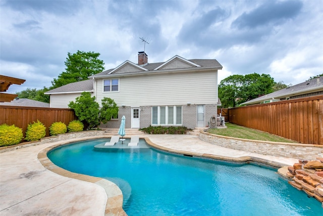 view of pool featuring a fenced backyard and a patio