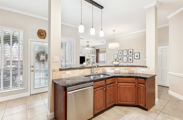 kitchen with tasteful backsplash, stainless steel dishwasher, ornamental molding, a sink, and dark stone countertops