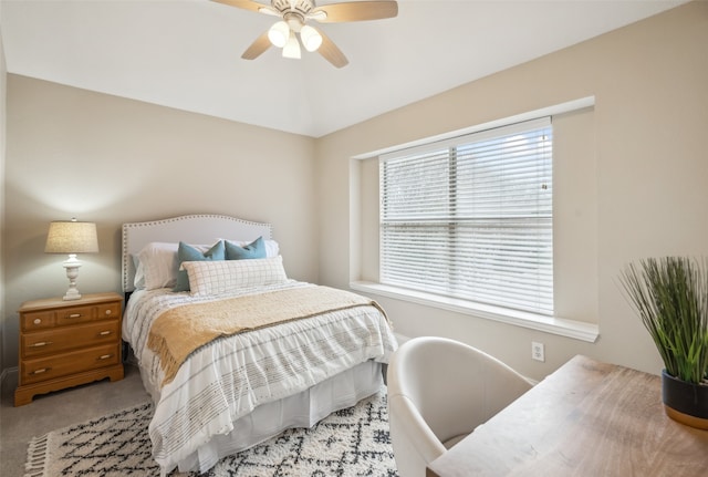 bedroom featuring a ceiling fan and light carpet