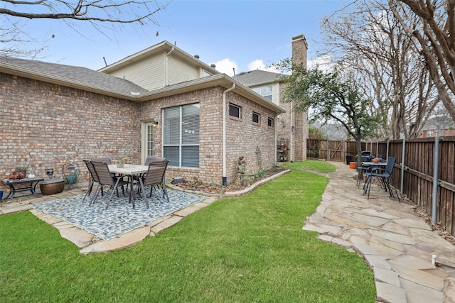 exterior space featuring a patio area and a fenced backyard