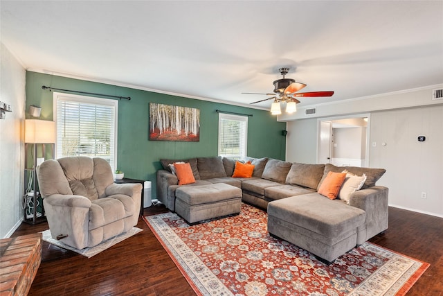 living room with ornamental molding, wood finished floors, and visible vents