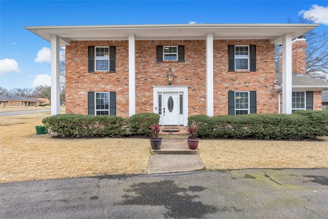 view of front of property featuring brick siding