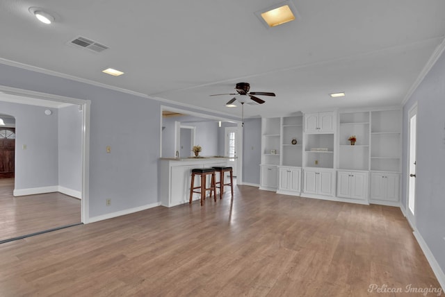 unfurnished living room featuring visible vents, baseboards, ceiling fan, crown molding, and light wood-style floors