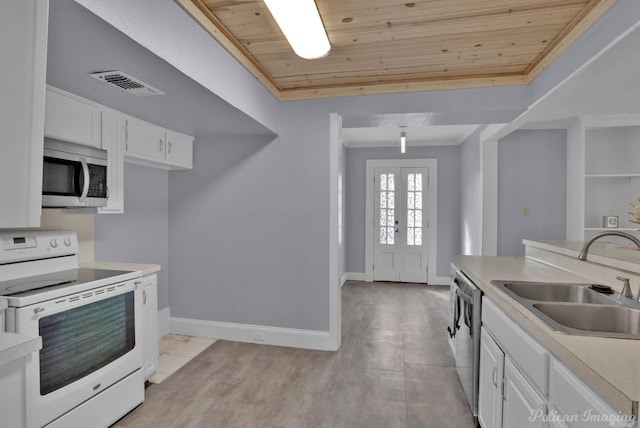 kitchen with wooden ceiling, a sink, visible vents, white cabinets, and appliances with stainless steel finishes