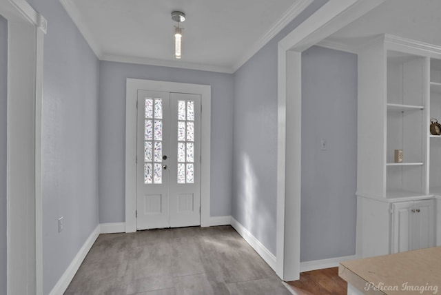entryway with baseboards, crown molding, and french doors