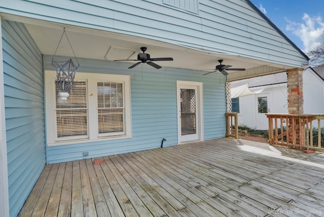 wooden terrace with a ceiling fan