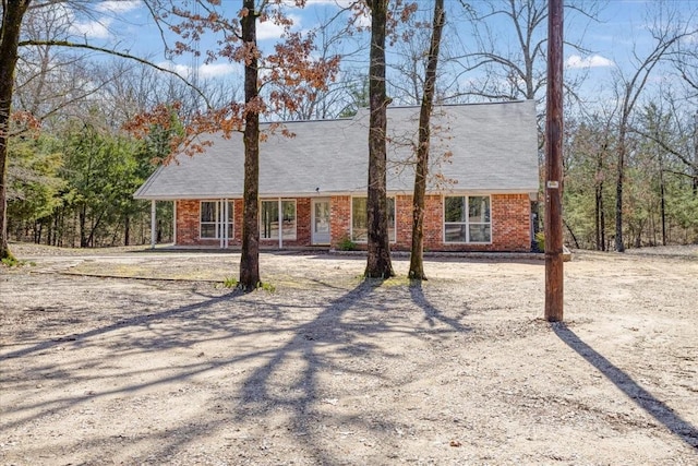 view of front facade featuring brick siding