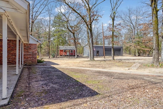 view of yard with an outdoor structure