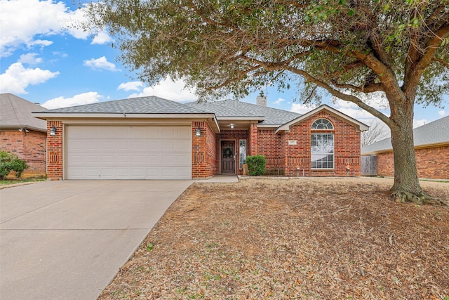 ranch-style house with brick siding, roof with shingles, a chimney, an attached garage, and driveway