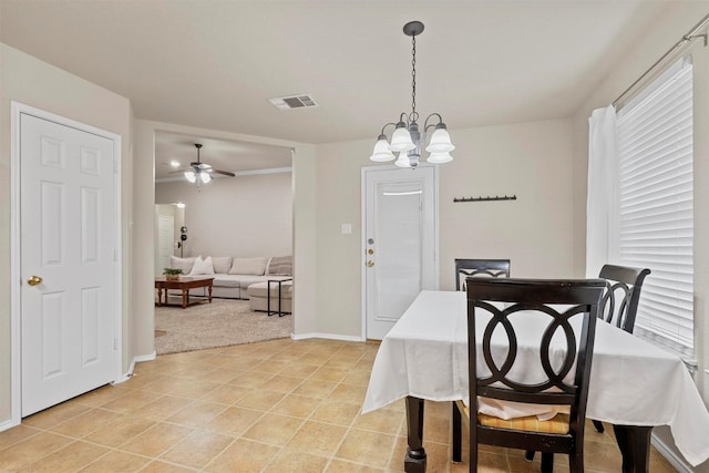 dining space featuring light tile patterned floors, ceiling fan with notable chandelier, visible vents, and baseboards