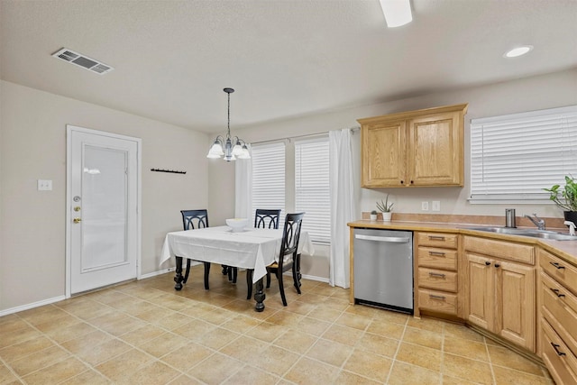 kitchen with pendant lighting, visible vents, light brown cabinets, a sink, and dishwasher