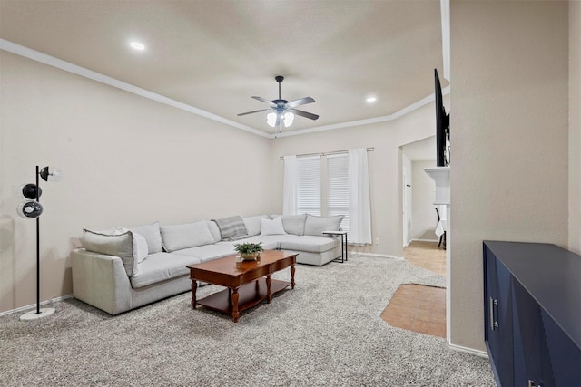 living area with light carpet, crown molding, and ceiling fan