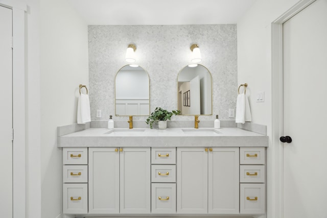 bathroom featuring double vanity and a sink