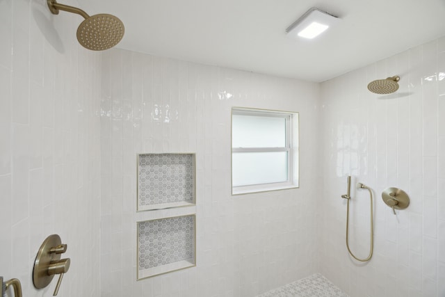 full bath with a tile shower