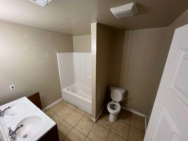 full bathroom with a sink, tile patterned flooring, toilet, and baseboards