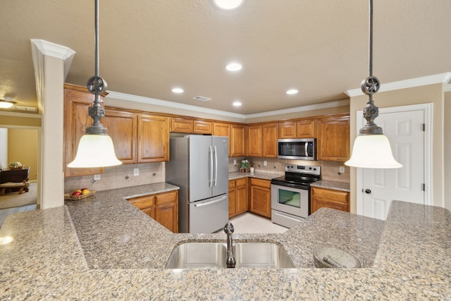 kitchen featuring a sink, stainless steel appliances, tasteful backsplash, and brown cabinetry