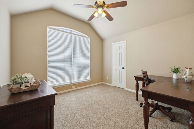 office featuring light carpet, baseboards, a ceiling fan, and lofted ceiling