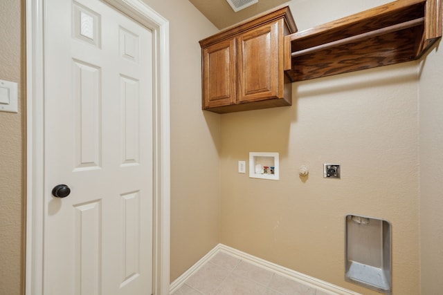 laundry area with hookup for a gas dryer, cabinet space, baseboards, hookup for an electric dryer, and hookup for a washing machine