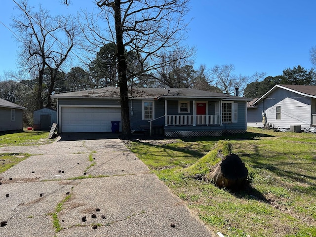 single story home with a front lawn, covered porch, driveway, and an attached garage