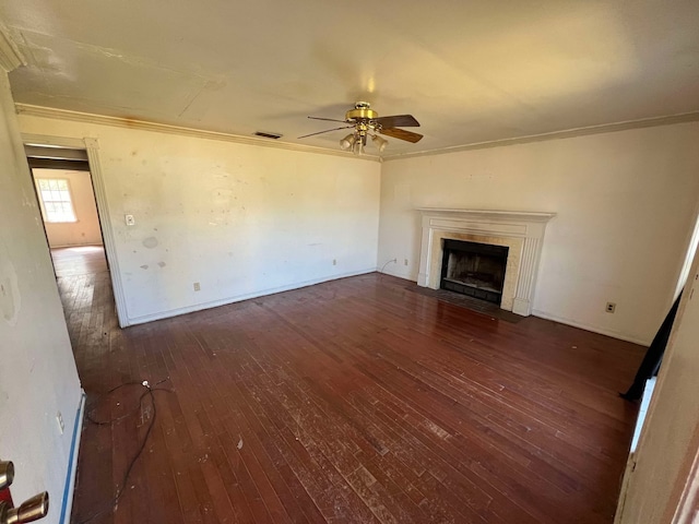 unfurnished living room featuring crown molding, a fireplace, wood-type flooring, visible vents, and ceiling fan