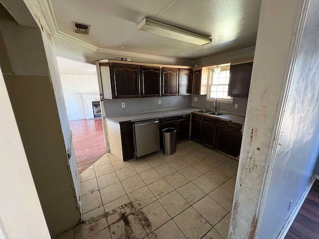 kitchen with dark brown cabinetry, visible vents, dishwasher, ornamental molding, and a sink