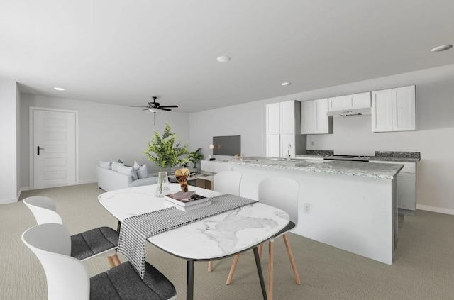 dining room featuring recessed lighting, light carpet, ceiling fan, and baseboards