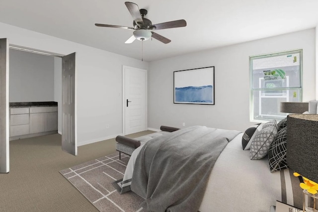 carpeted bedroom with a ceiling fan and baseboards