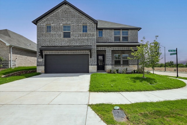 view of front of house with brick siding, a garage, stone siding, concrete driveway, and a front yard