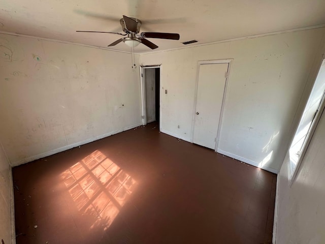 unfurnished bedroom with ceiling fan and visible vents