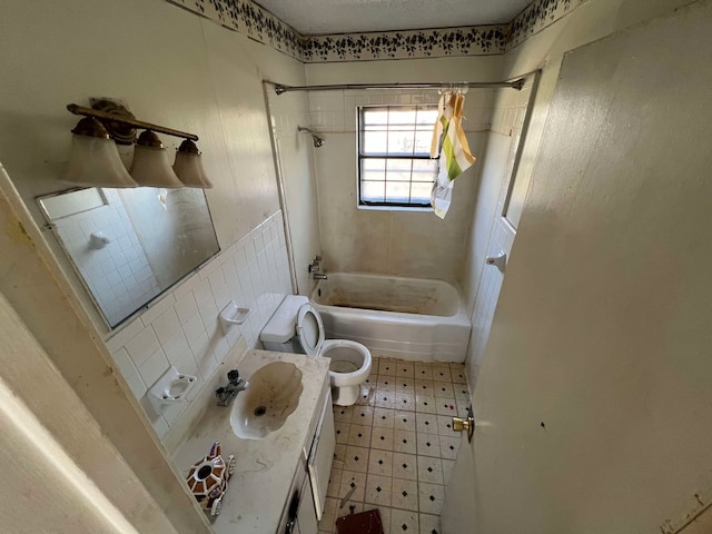 full bathroom featuring washtub / shower combination, vanity, toilet, and tile patterned floors