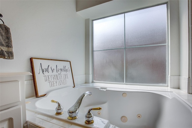 full bath with a tub with jets